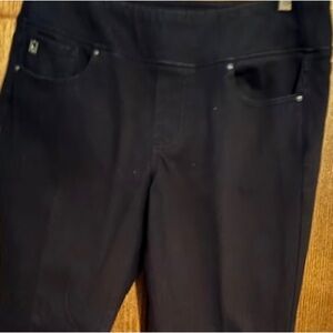 Belle by Kim Gravel black denim jeans with faux pearl accents at leg.